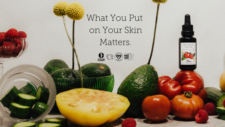 main image on pleni skincare website featuring day squad face oil surrounding by nutritious foods such as tomato, cucumber and avocado